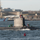 Santa stands on the bow of the USS Vermont.